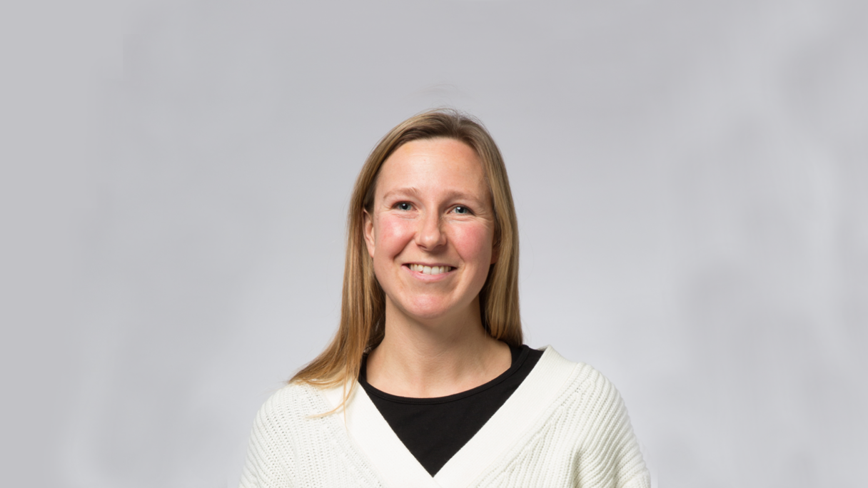 Headshot of Jane Masoli wearing a white jumper